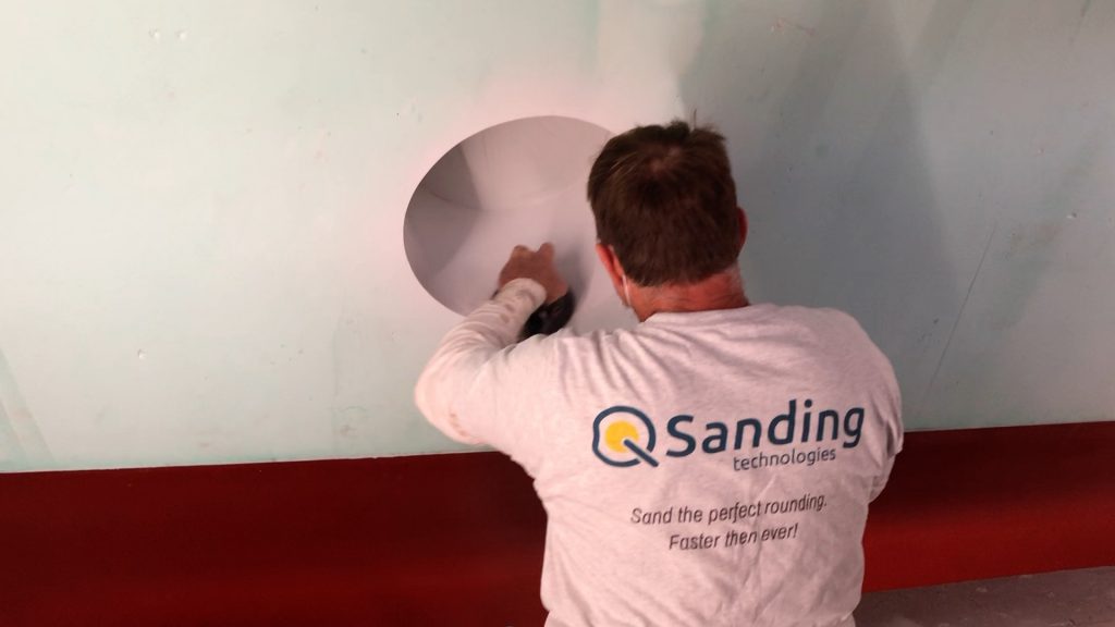 Sanding porthole with Q-Sander